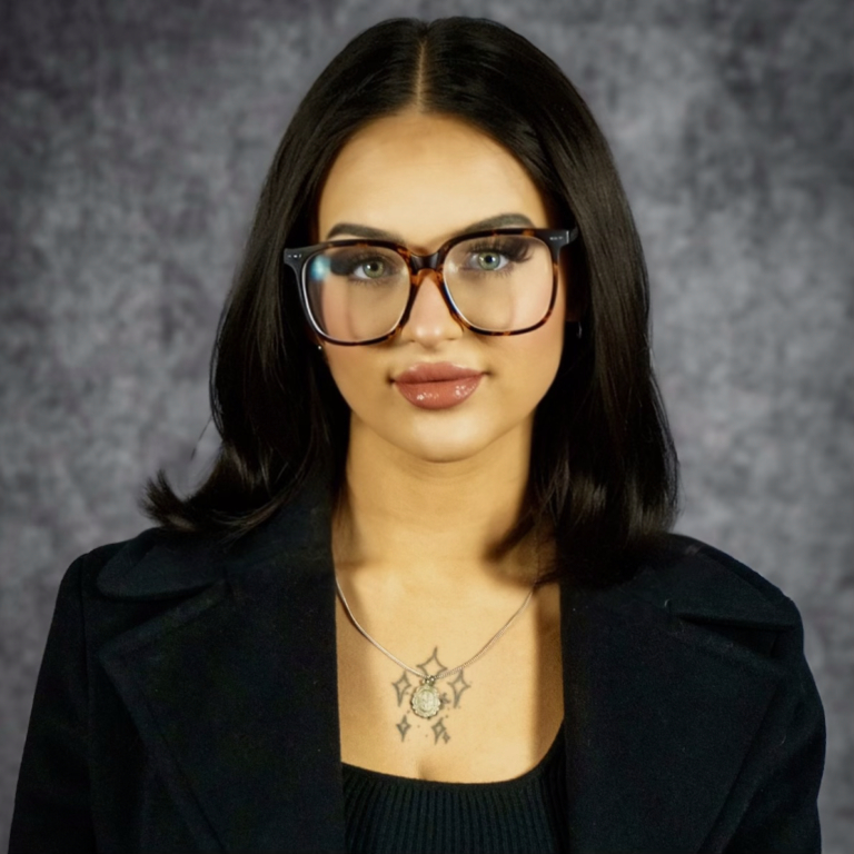 Portrait of woman with glasses and necklace