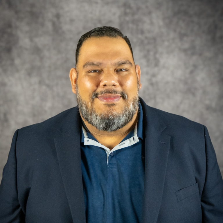 Smiling bearded man in blazer