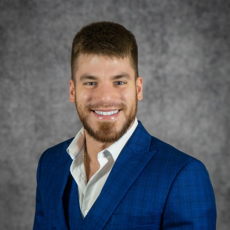Smiling man in blue suit jacket