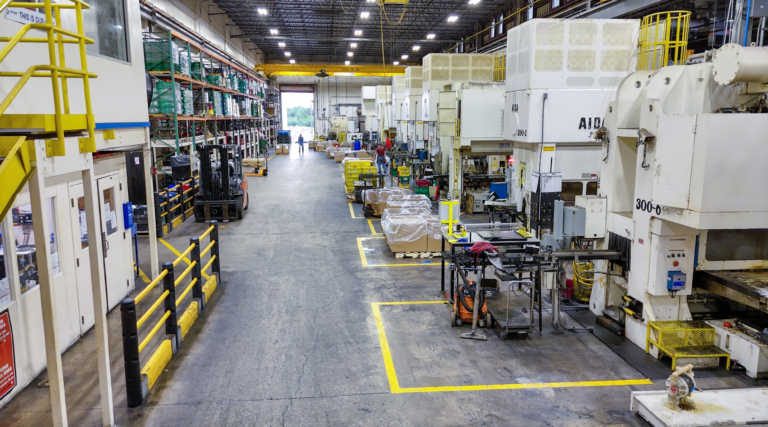 Factory production floor with machines and pallets