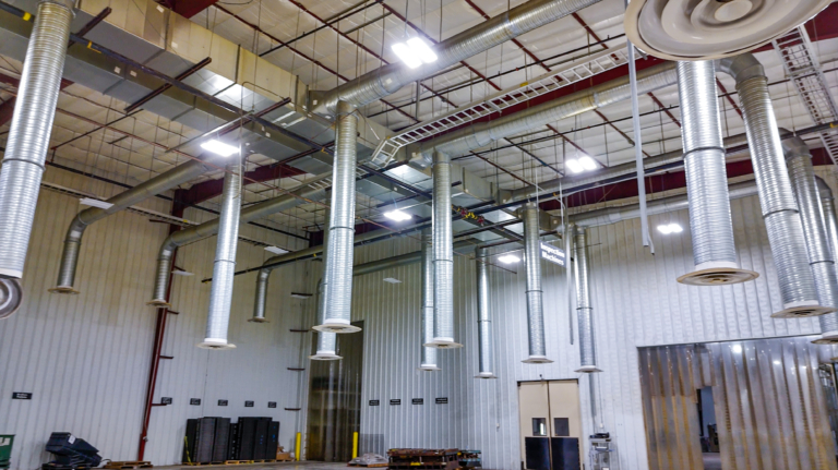 High ceiling with hanging ventilation ducts